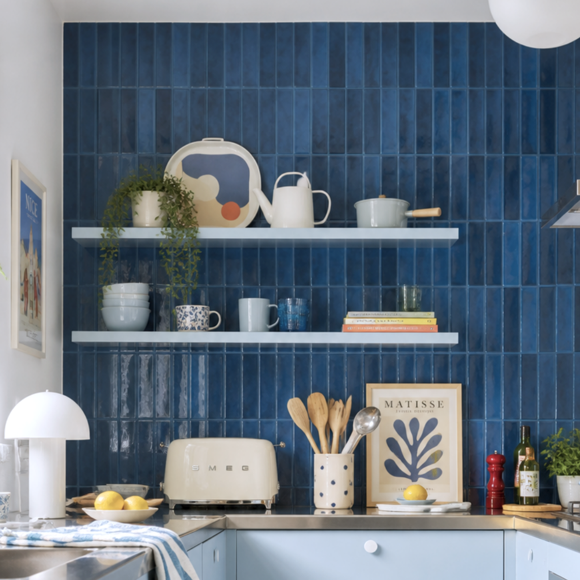 Classic Indigo peel and stick tiles kitchen backsplash, glossy deep blue vertical tiles, modern Scandinavian kitchen with warm wood accents