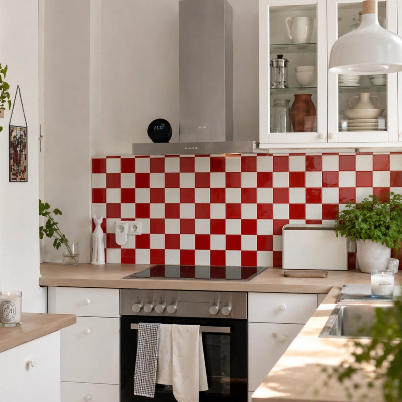 red and white checkerboard peel and stick tiles kitchen backsplash, glossy ceramic finish, bright Scandinavian kitchen with wood countertop
