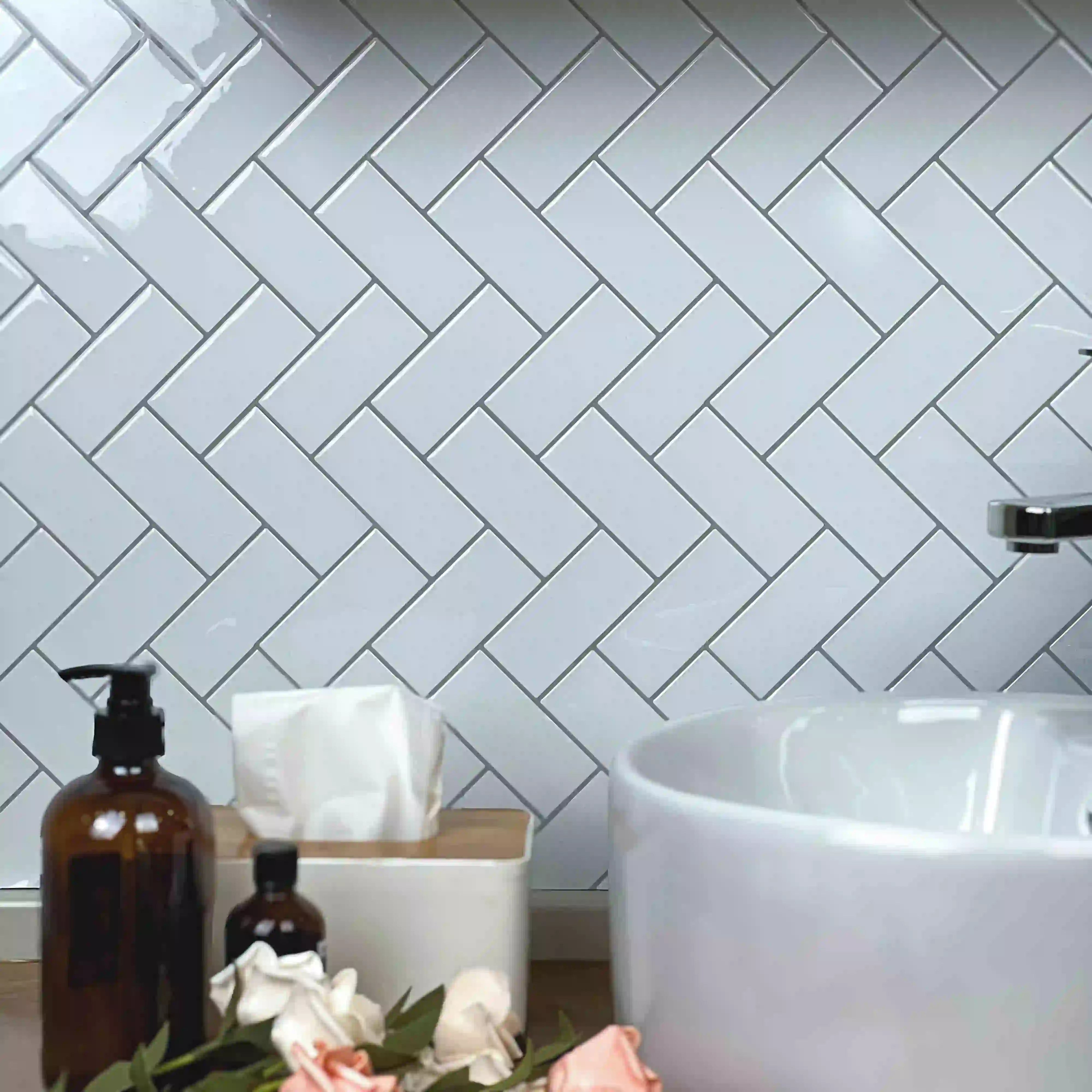 Stickwoll Peel and Stick Herringbone Tiles, featuring a classic chevron pattern with a modern twist; displayed in a stylish and functional home setting
