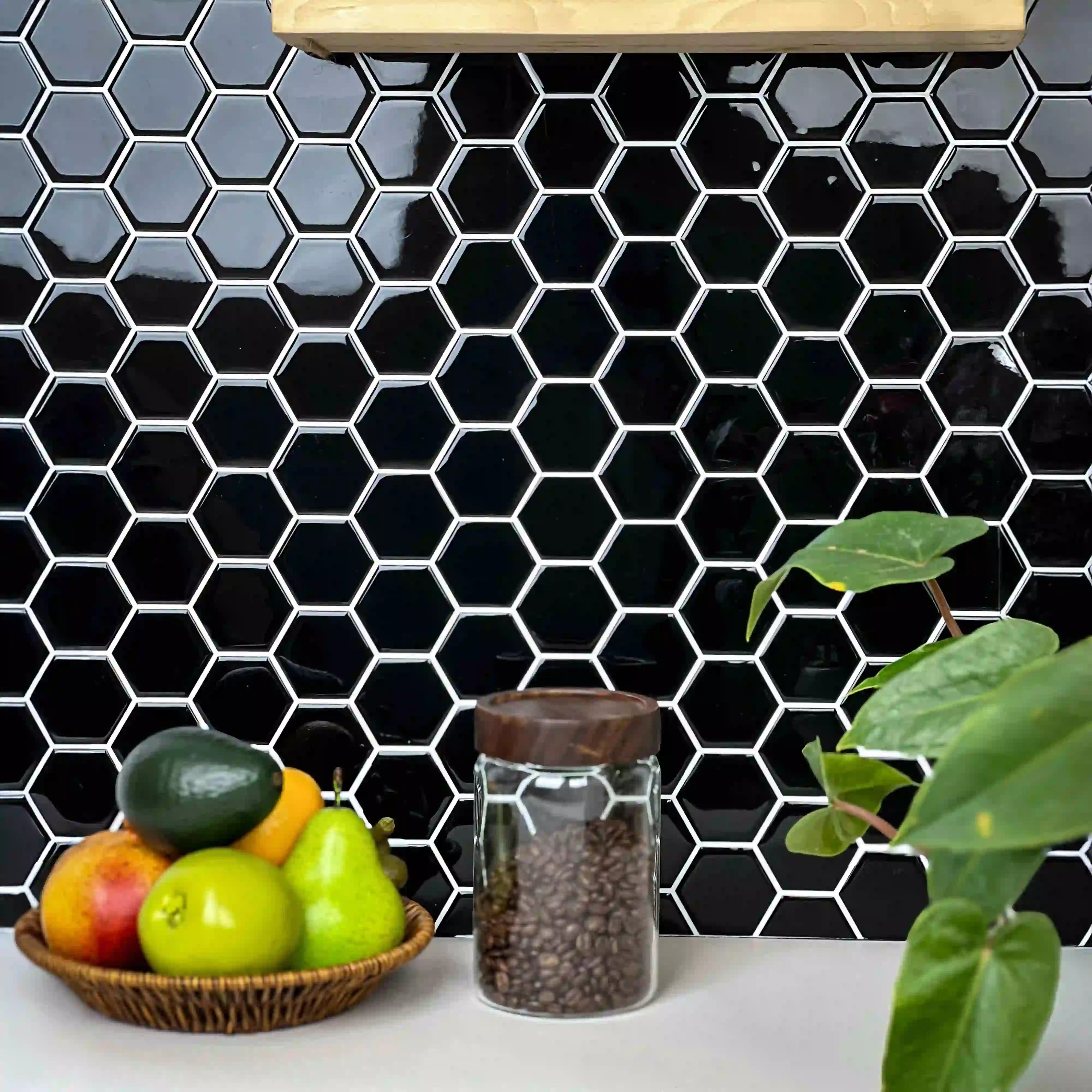 Stickwoll Peel and Stick Hexagon Tiles series showcased in a minimalist kitchen; featuring Onyx Hexagons Tiles on the wall, styled with a fruit bowl, coffee beans, and a green potted plant for a sleek and modern aesthetic