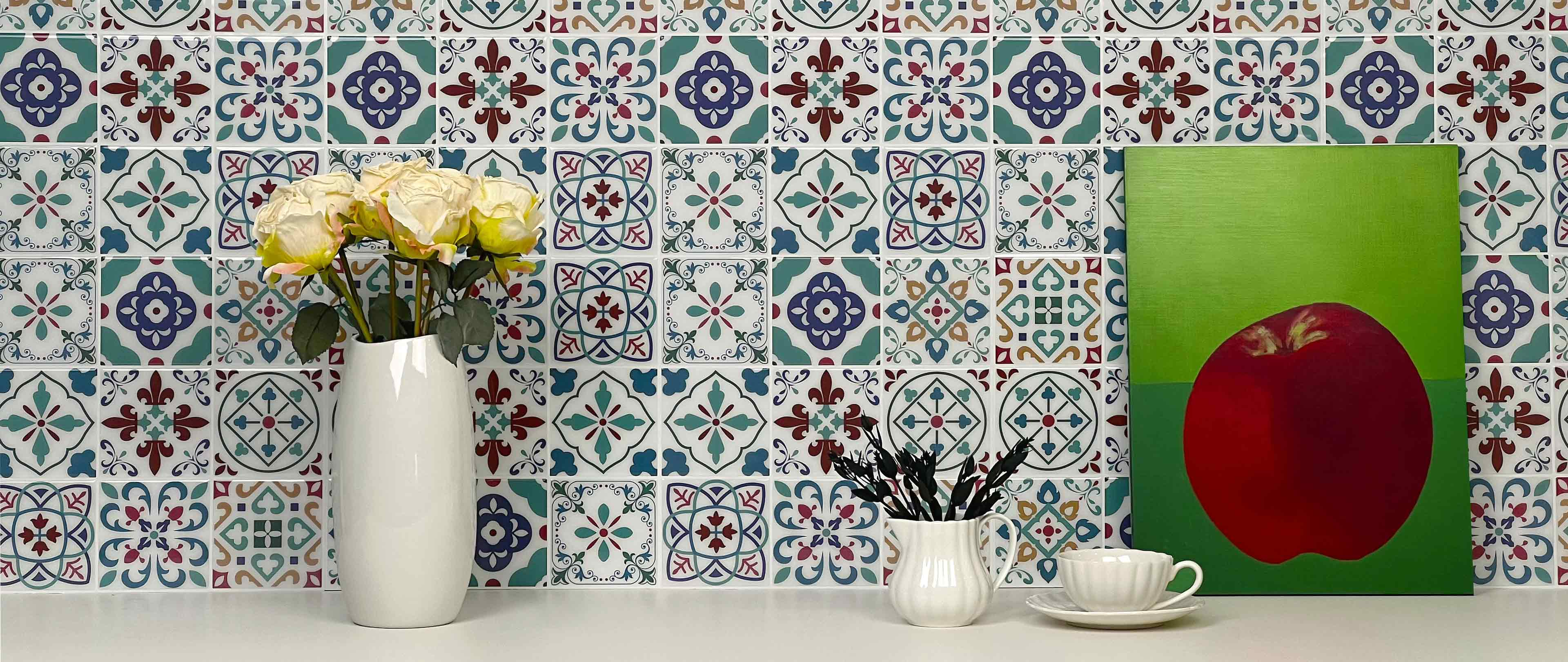 Stickwoll Peel and Stick Bohemian Tiles series displayed in a minimalist kitchen; featuring Indigo Nomad Tiles, styled with a green apple and flowers in a paper bag for a fresh and modern decor vibe