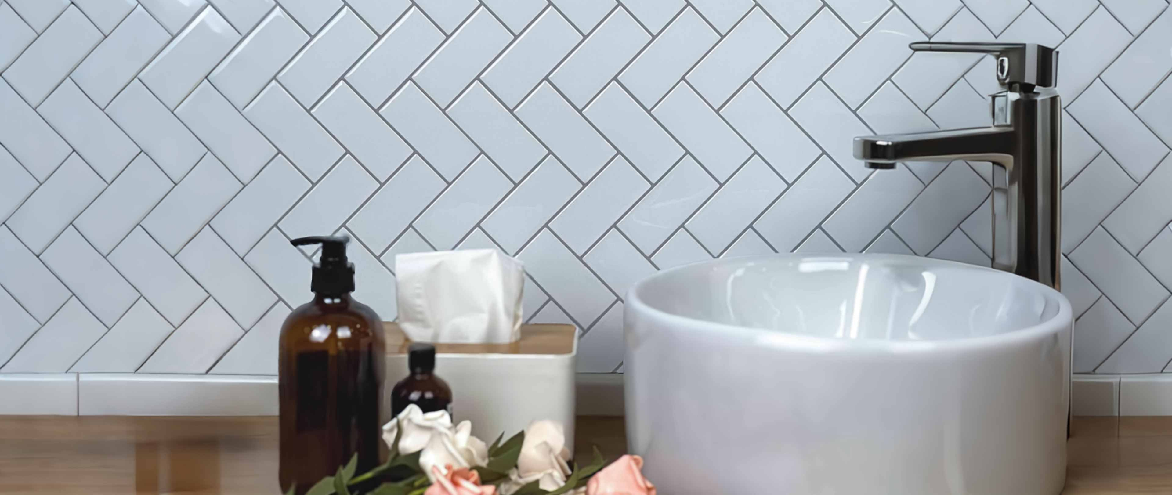 Stickwoll Peel and Stick Herringbone Tiles, featuring a classic chevron pattern with a modern twist; displayed in a stylish and functional home setting