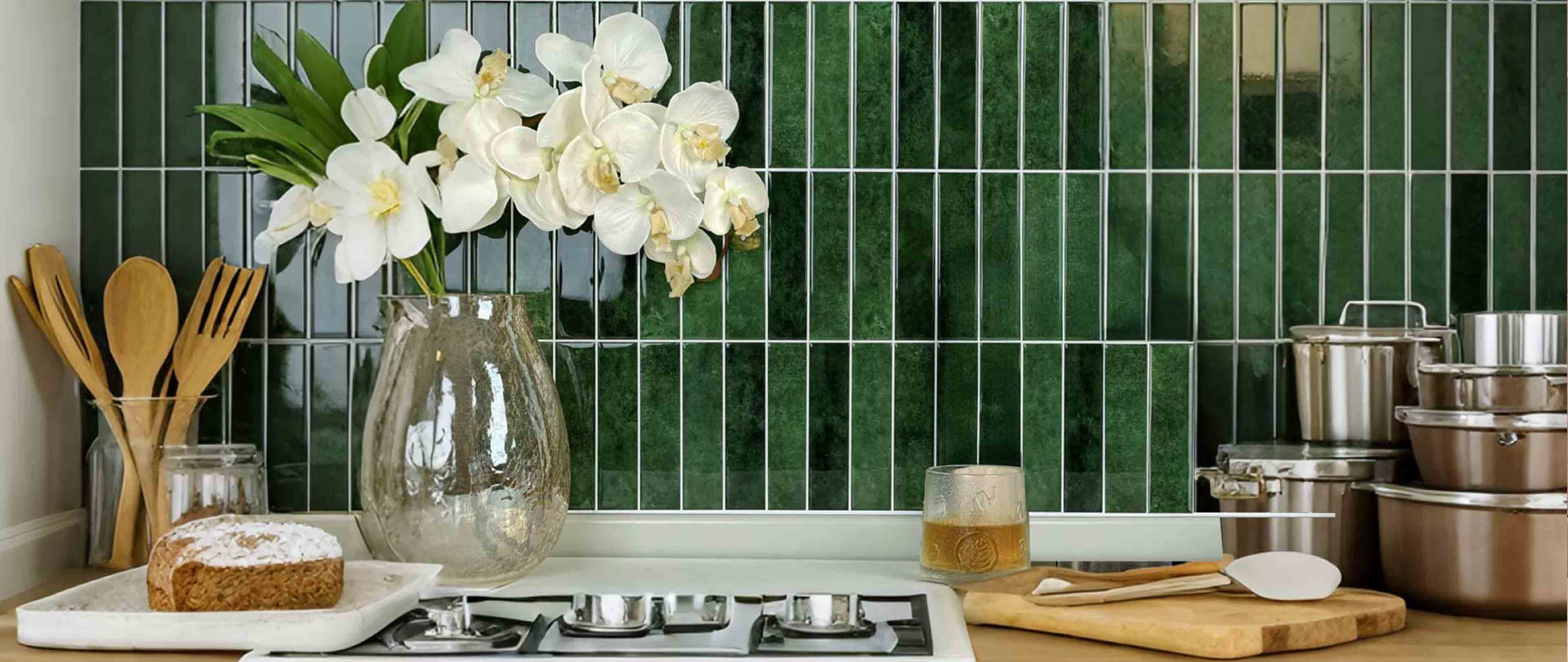 Stickwoll Peel and Stick Gradient Strips Tiles series displayed in a minimalist bathroom; featuring Minty Ceramic Tiles on the wall, styled with a brown vase holding greenery, a towel, and a tray for a fresh and elegant decor