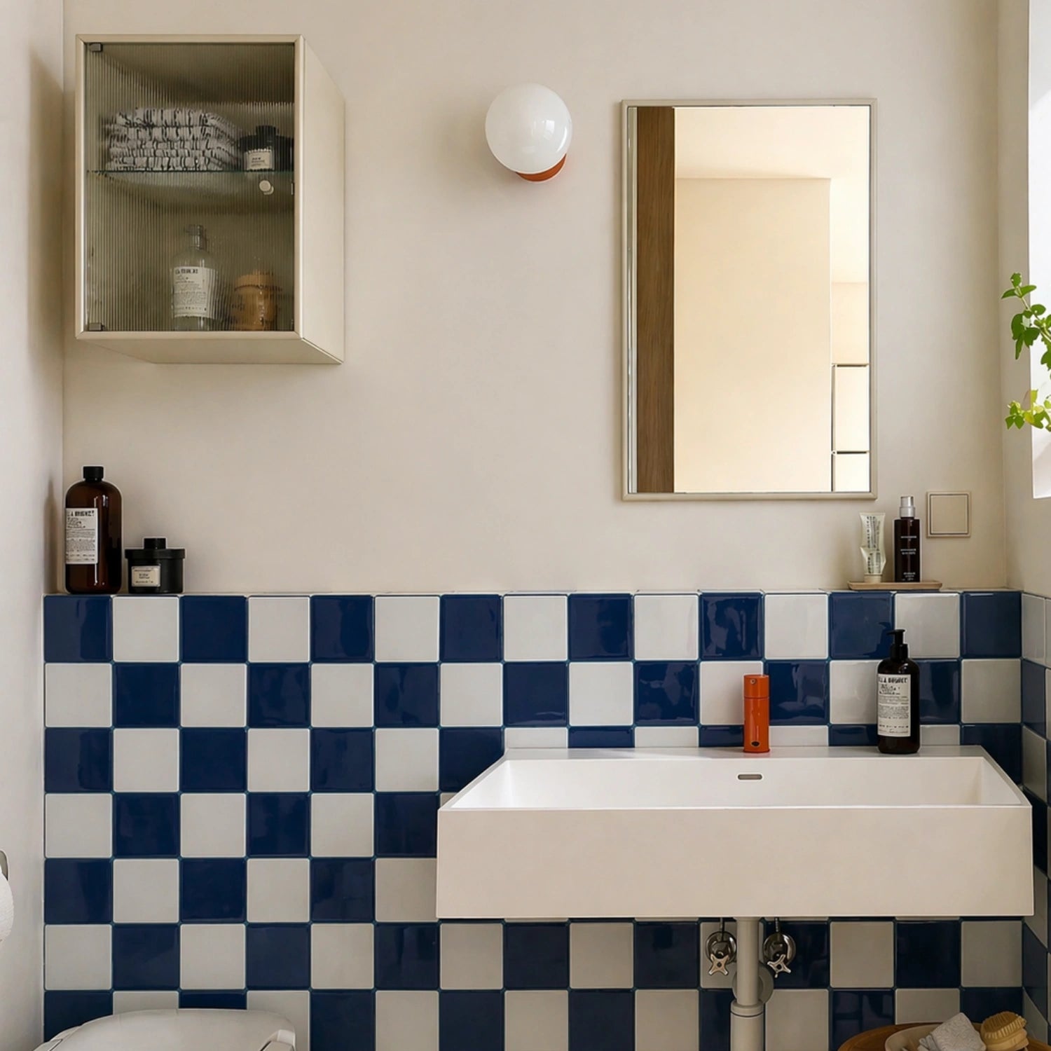 blue and white checkerboard peel and stick tiles bathroom backsplash, minimalist sink area, glossy ceramic tiles, soft neutral interior