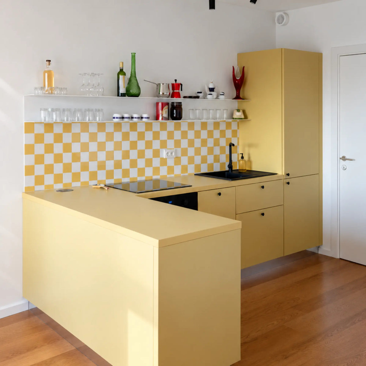 Modern yellow kitchen with Primrose Courtyard checkerboard peel and stick backsplash tiles