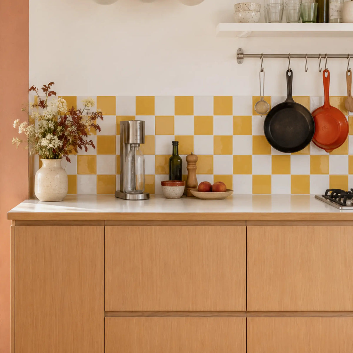 Warm wooden kitchen with Primrose Courtyard yellow and white checkerboard peel and stick tile backsplash